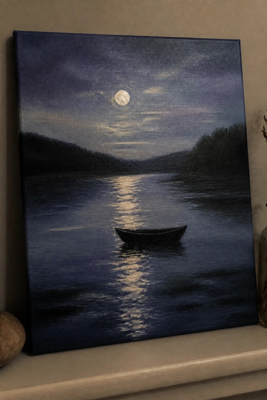 Moonlit night with full moon reflecting on water, small boat, and dark hills.