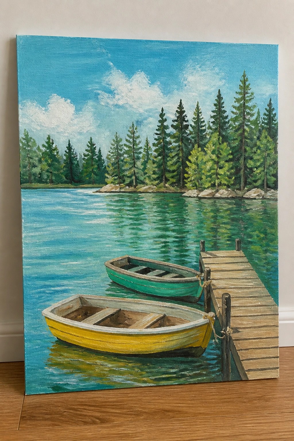 Yellow and green rowboats tied to a wooden dock on a pine-lined lake.