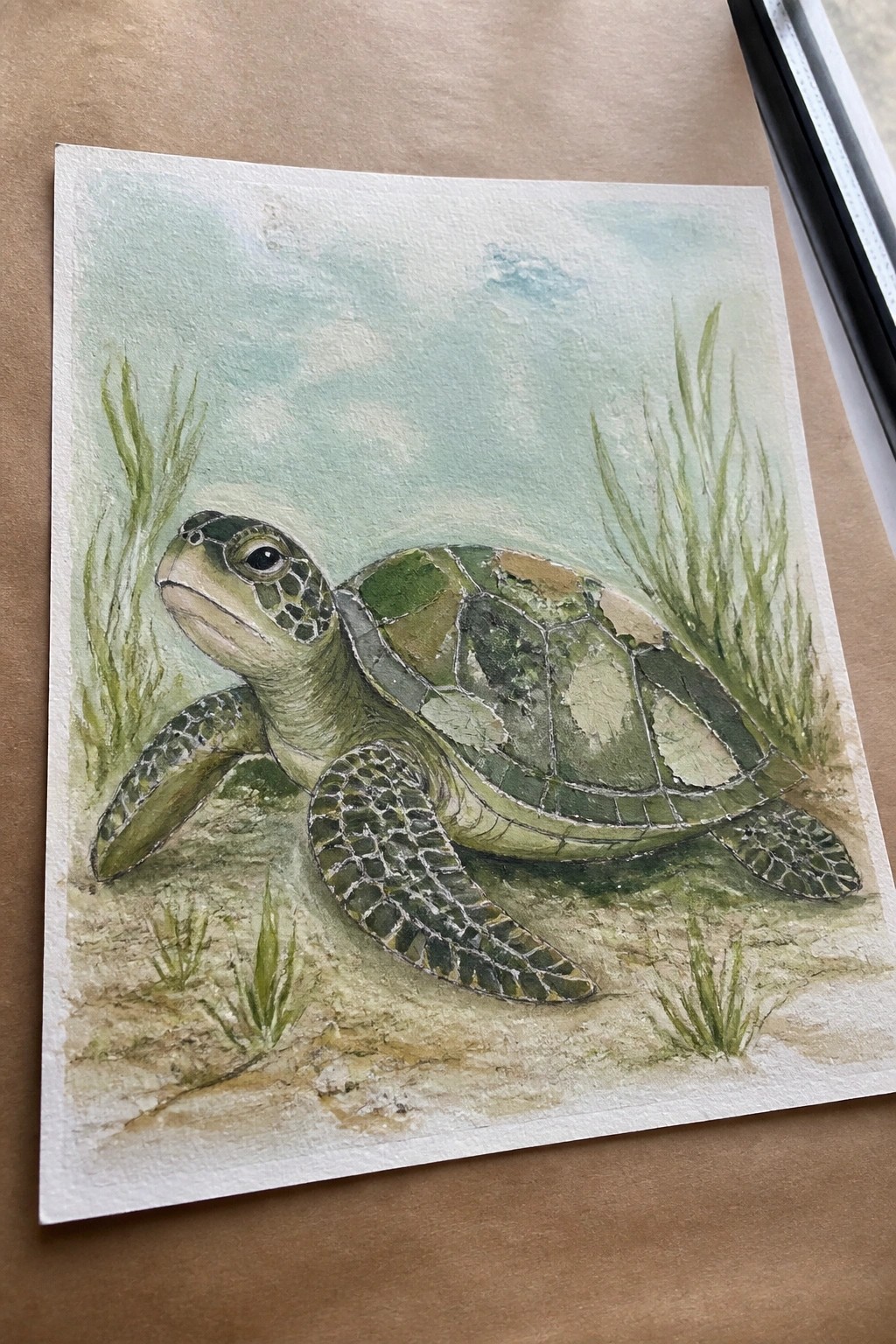 Watercolor sea turtle with green shell on sandy seabed amid swaying seagrass
