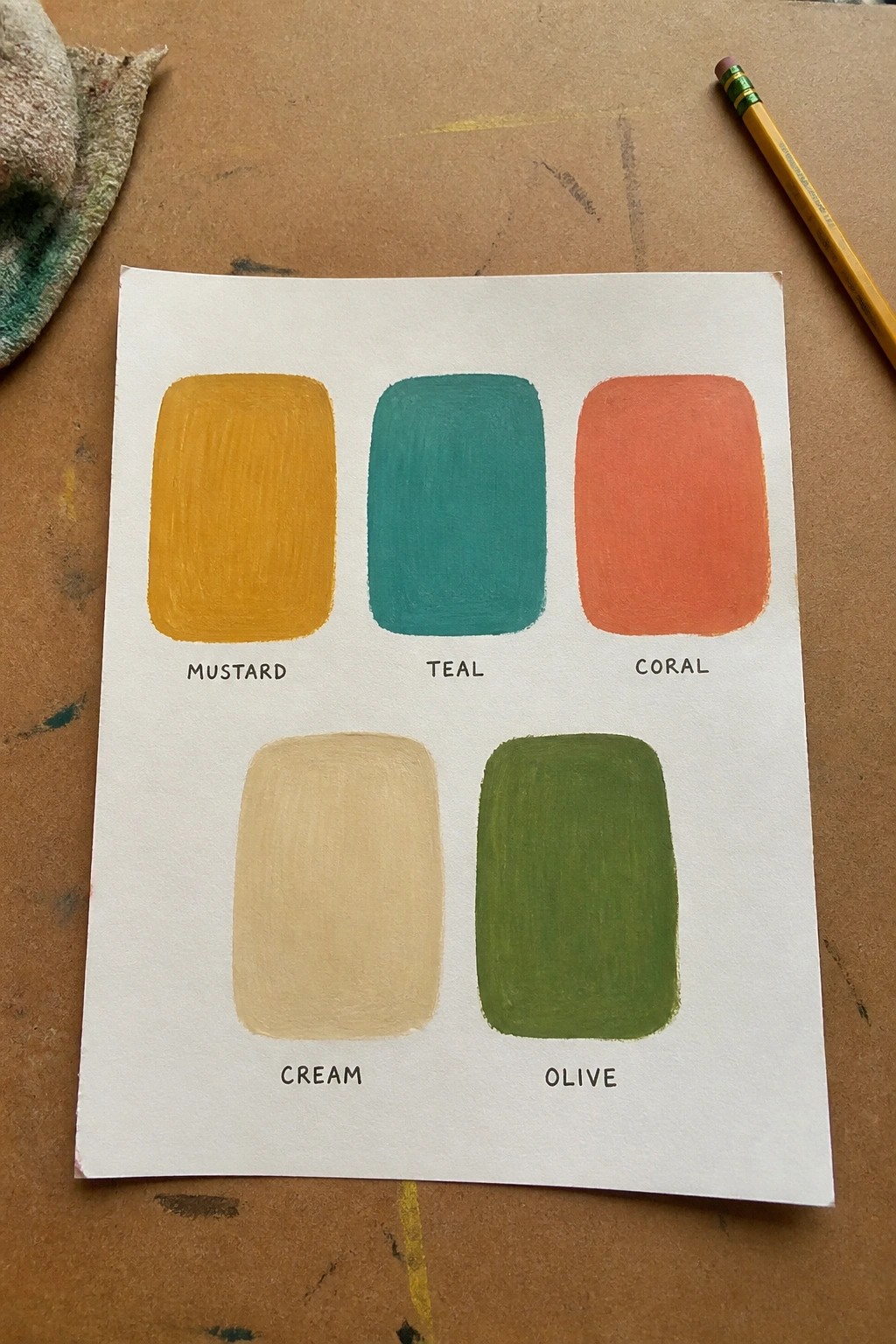 Five hand-painted color swatches labeled mustard, teal, coral, cream, and olive on paper.