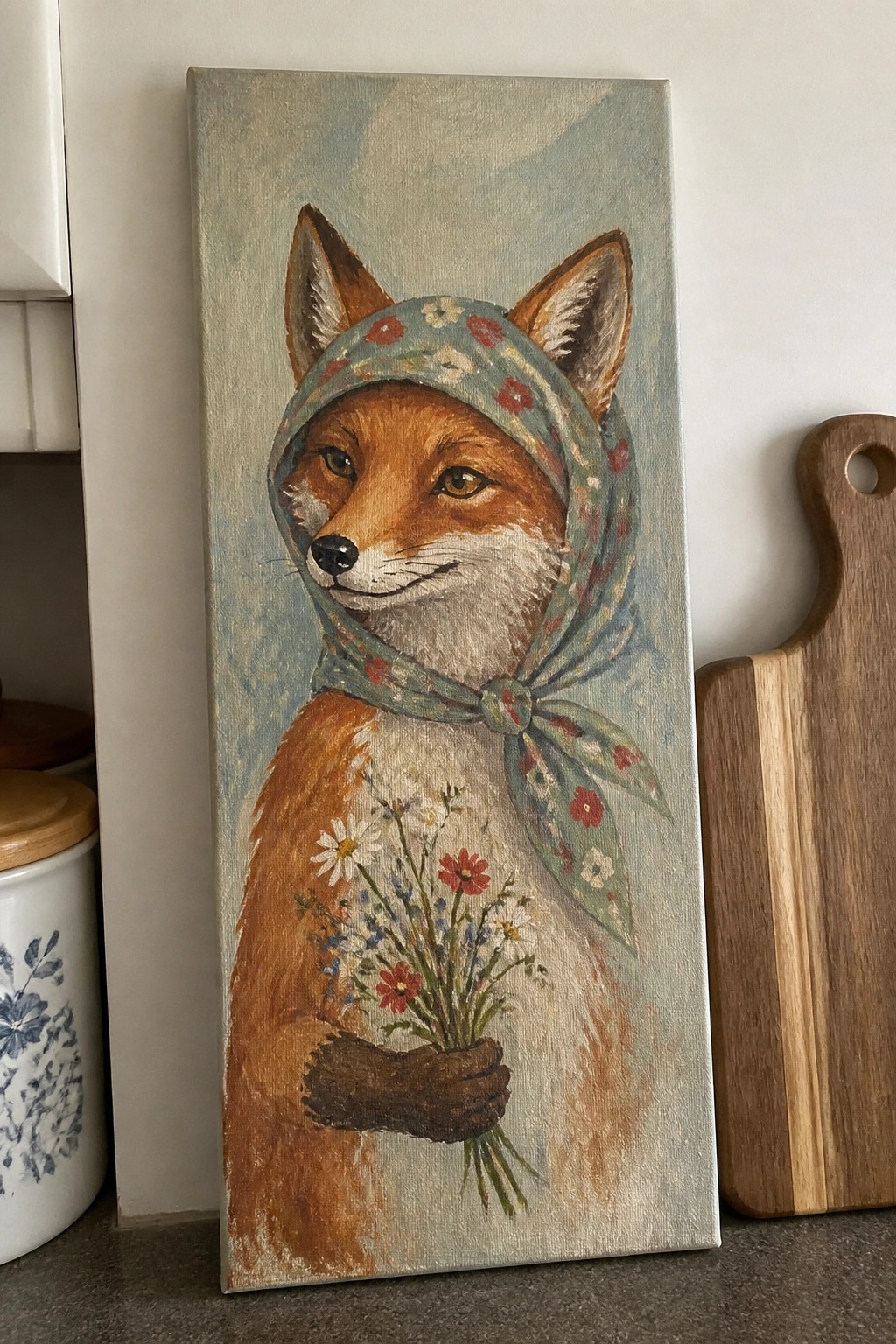 An acrylic painting of a fox wearing a blue floral headscarf and holding a bouquet of wildflowers against a soft blue background.