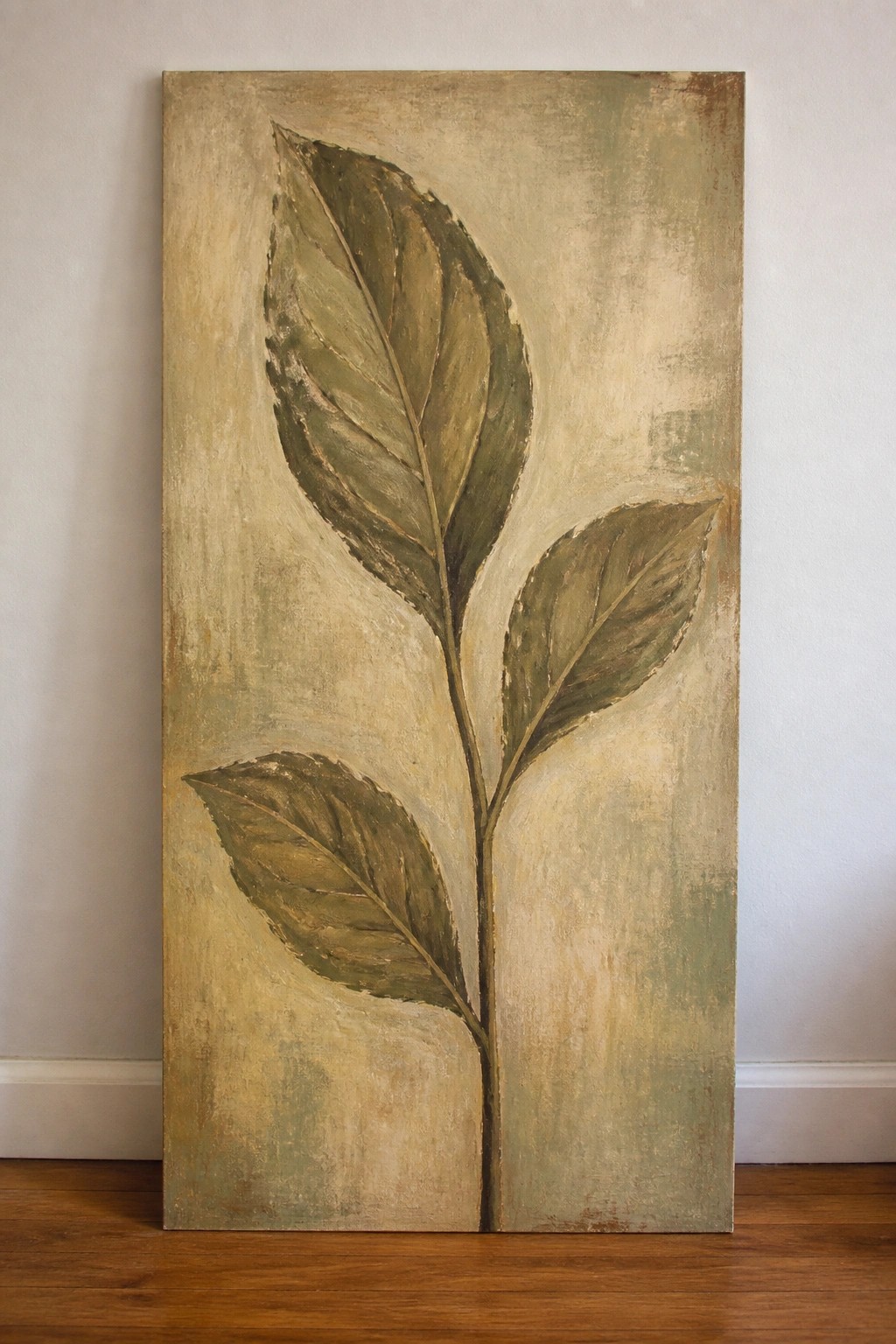 Tall vertical canvas painting of green leaves on stem against textured beige background