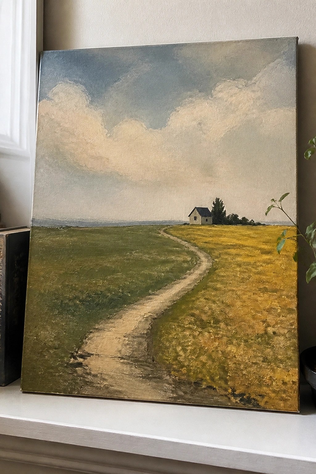 Landscape painting of winding path through green and yellow fields to small house under clouds.