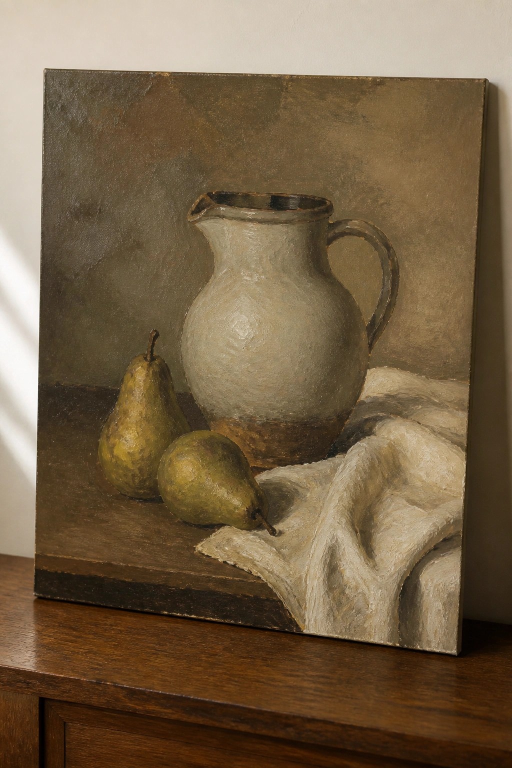 Oil painting of a ceramic pitcher, two pears, and white cloth on wood.