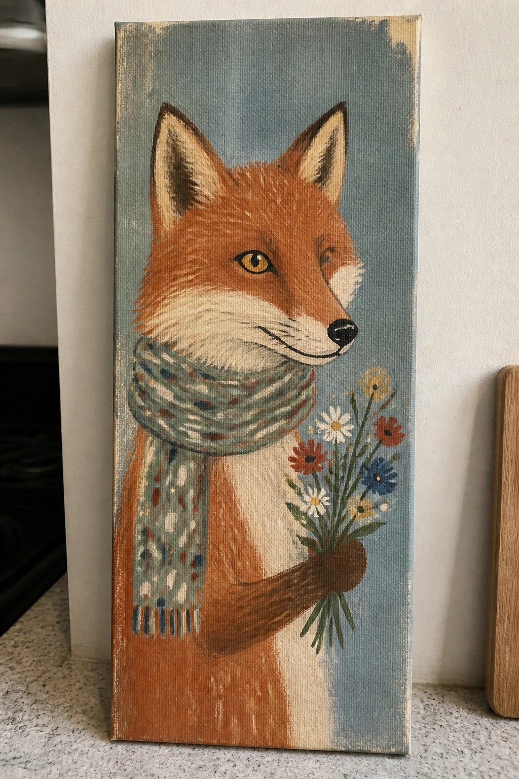 Orange fox in patterned scarf holds colorful flower bouquet on blue canvas.