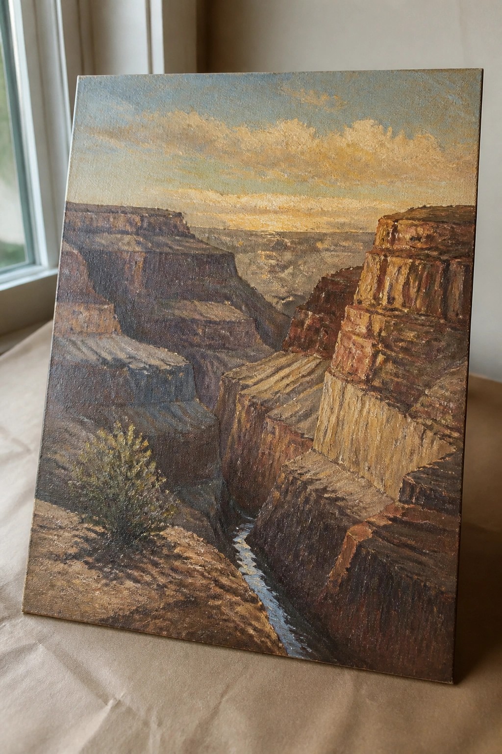 Oil painting of Grand Canyon at sunset with layered cliffs and winding river
