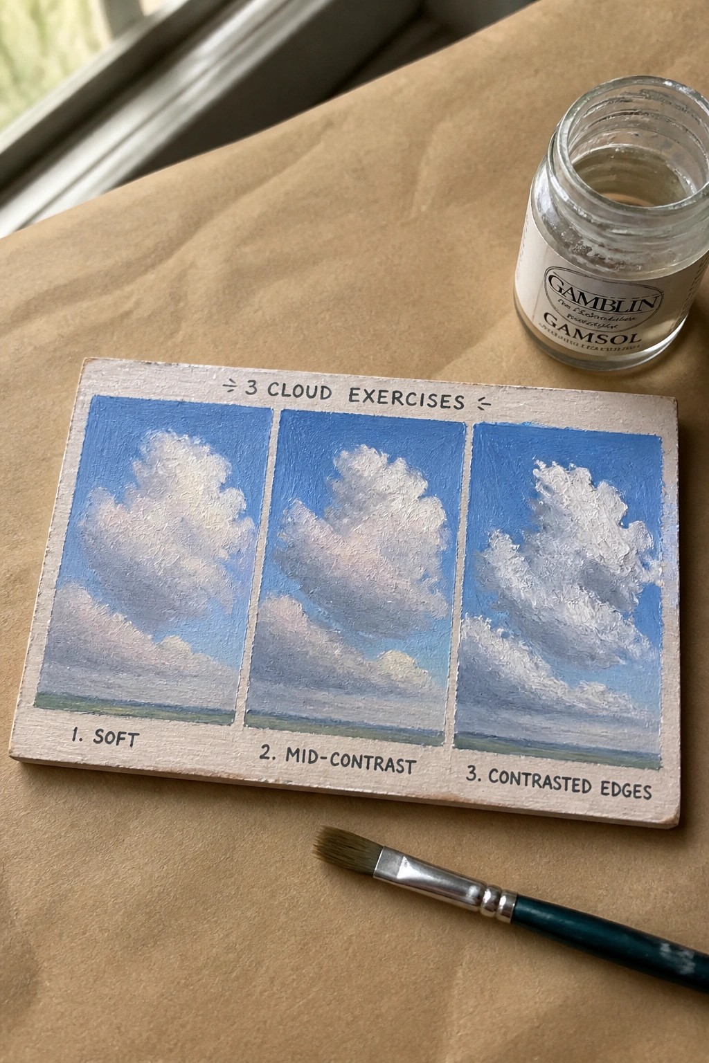 Three cloud studies on wood: soft, mid-contrast, contrasted edges with Gamsol jar and brush.