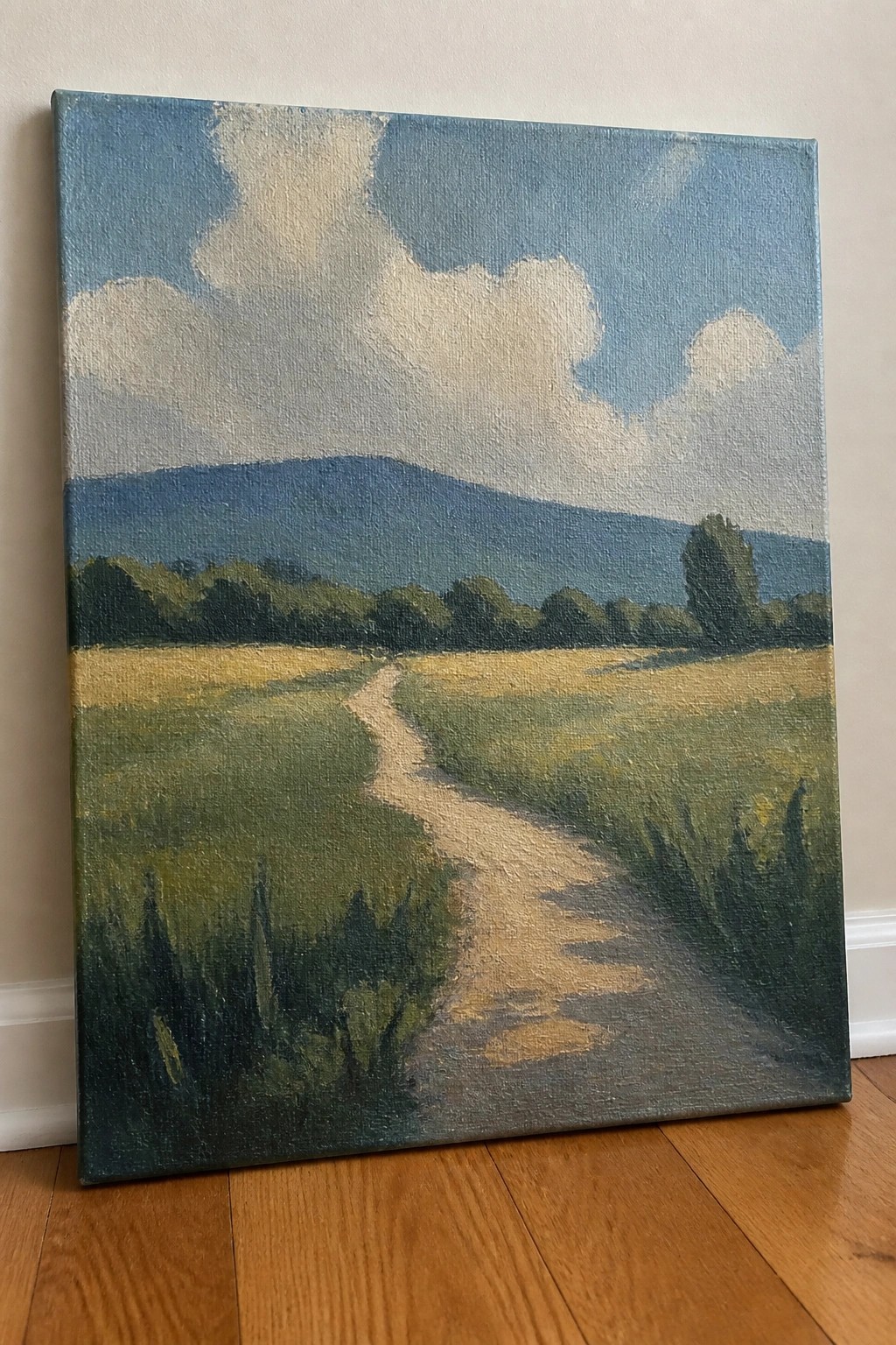 Landscape painting of winding path through fields to blue mountains under cloudy sky