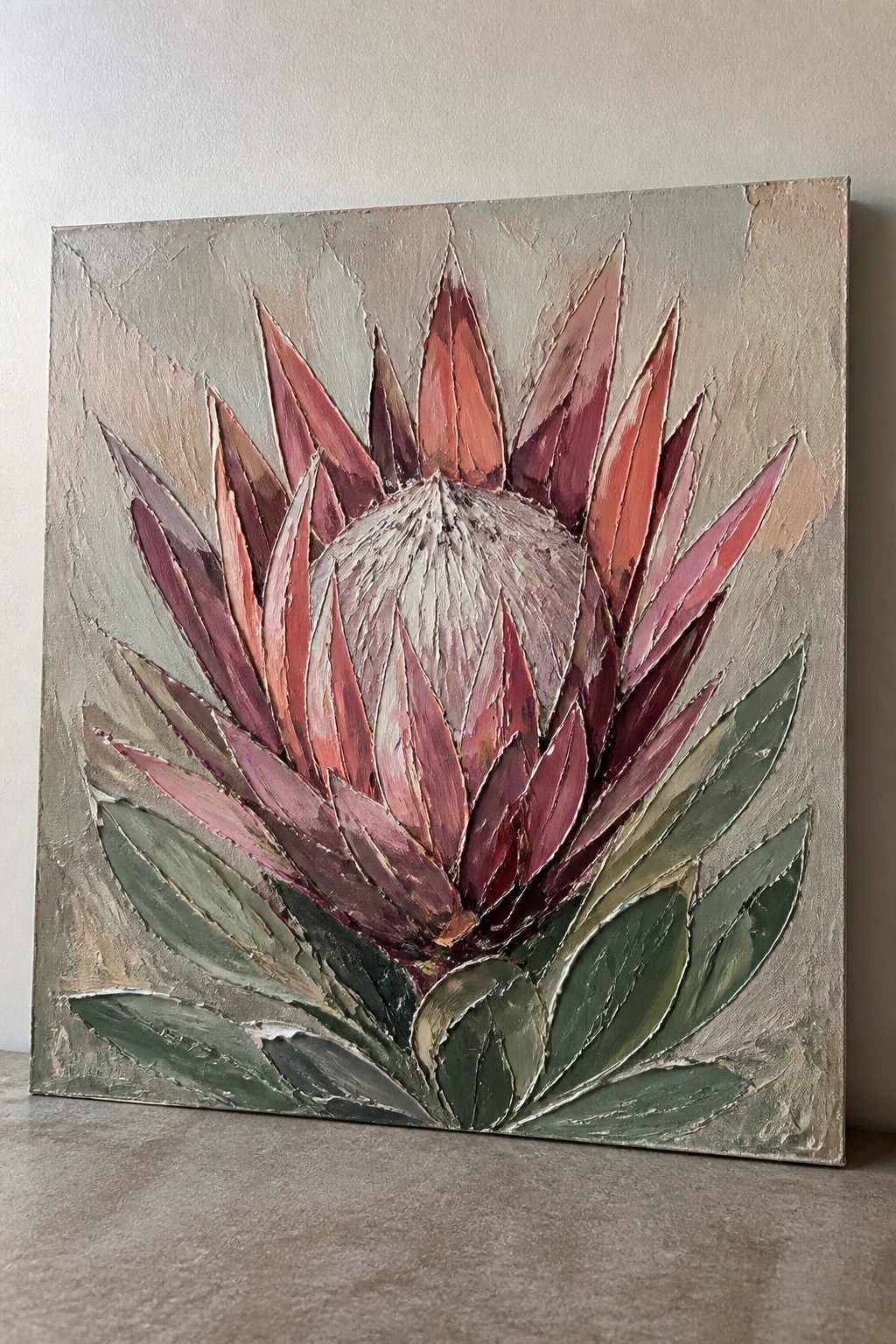 Thickly textured painting of a pink protea flower with green leaves on canvas.