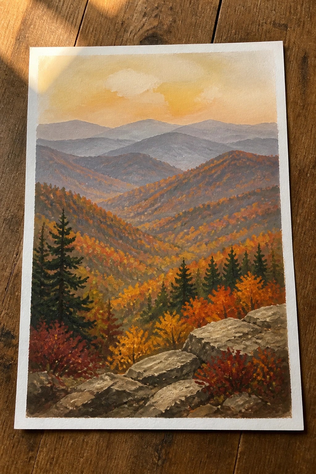 A painting of layered mountain ranges in autumn colors with rocks in the foreground.