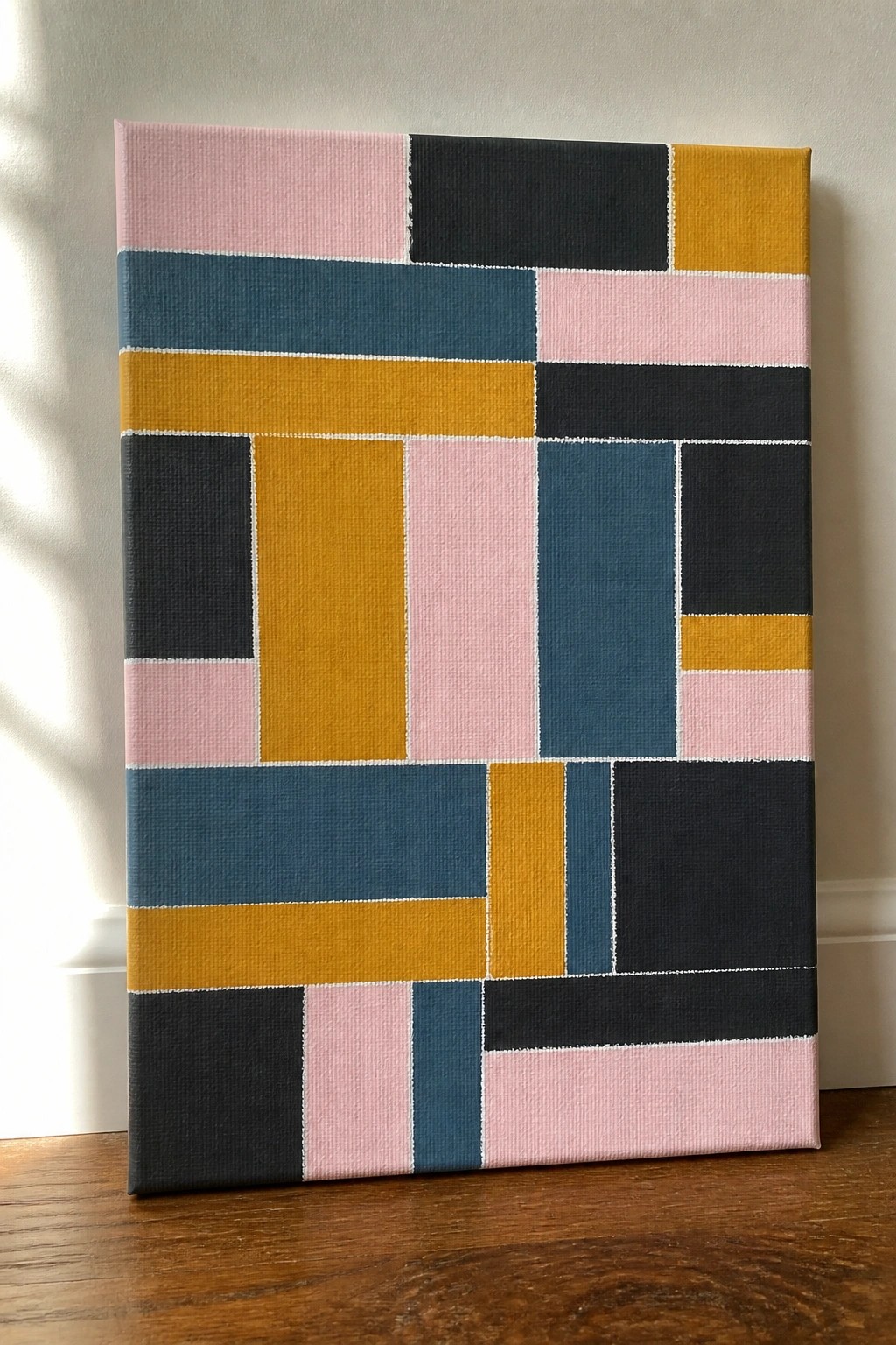 Abstract geometric canvas with colorful rectangles in pink, yellow, blue, teal, and black.