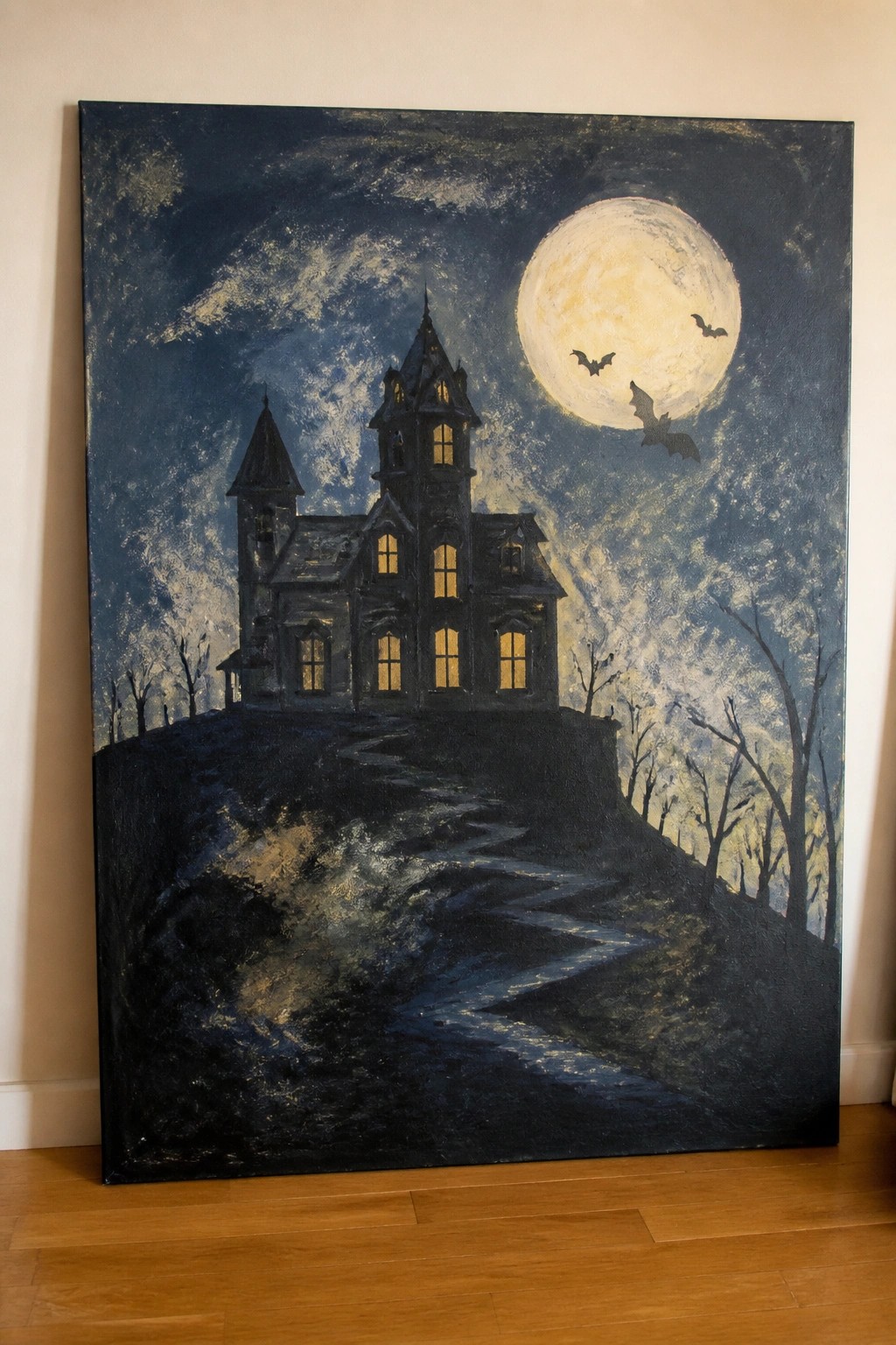 Gothic mansion on hill under full moon with bats and winding path.
