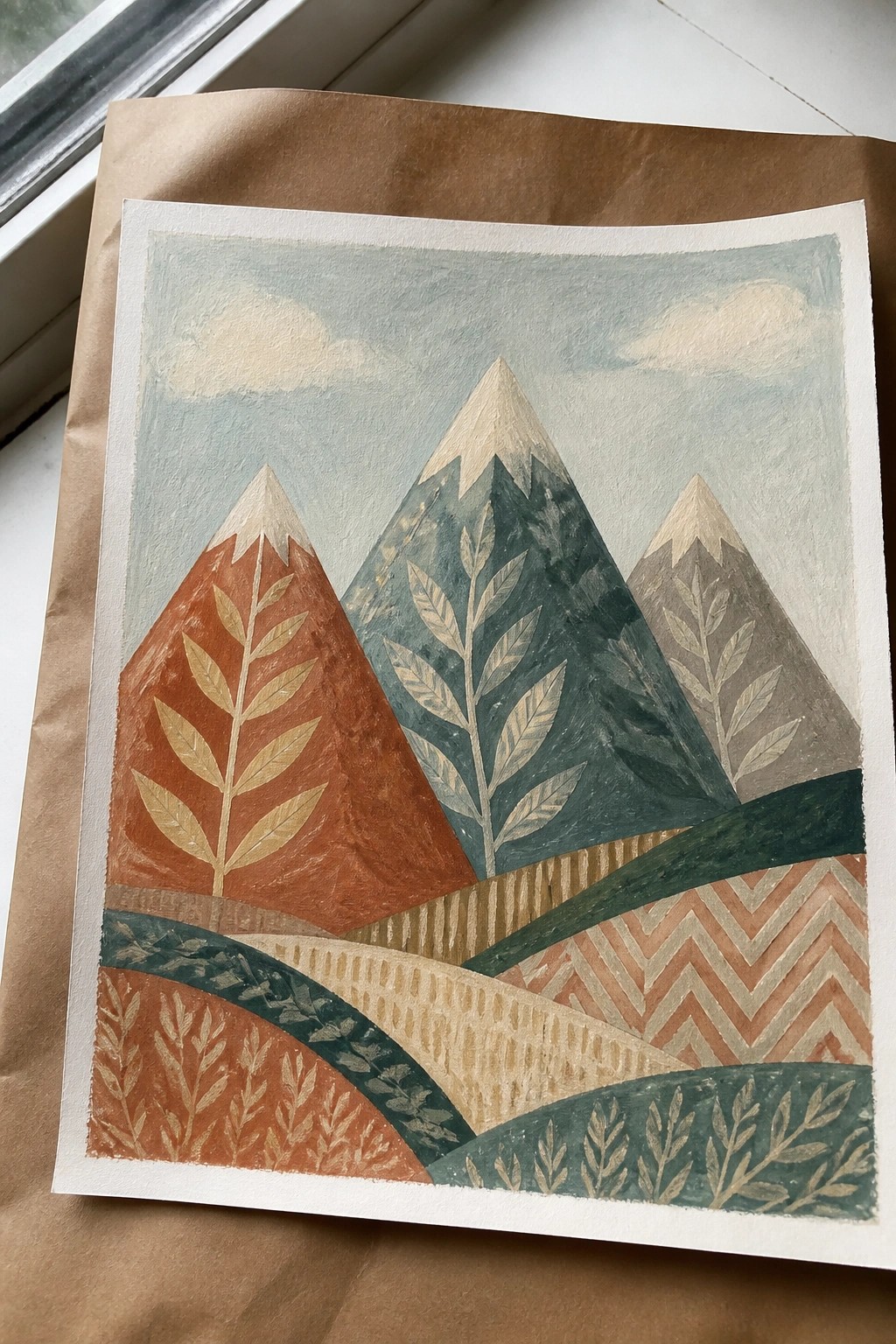 Stylized painting of three snow-capped mountains with golden leaf patterns in earthy tones.
