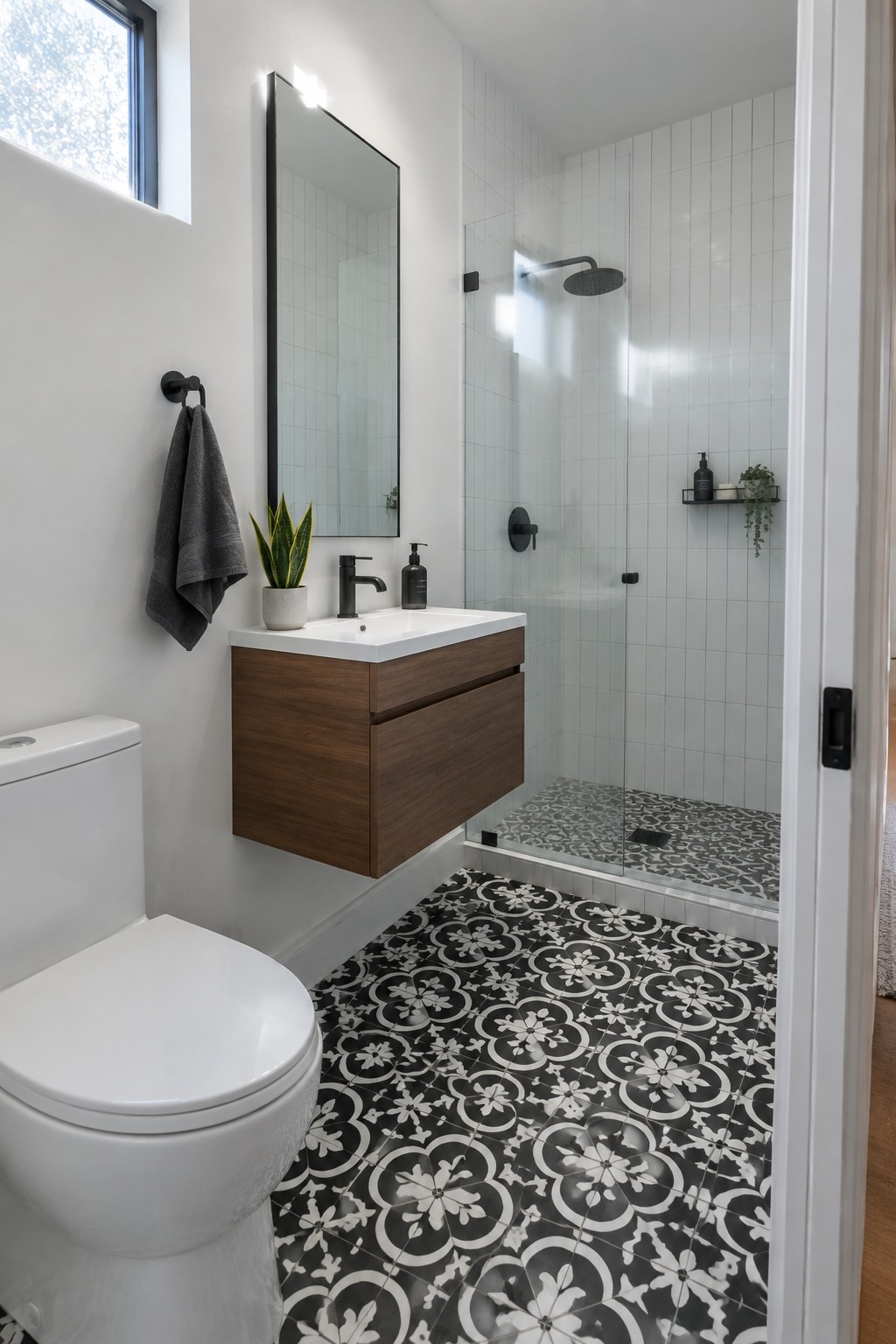 Bright white bathroom walls painted to match the white subway tile in the shower.