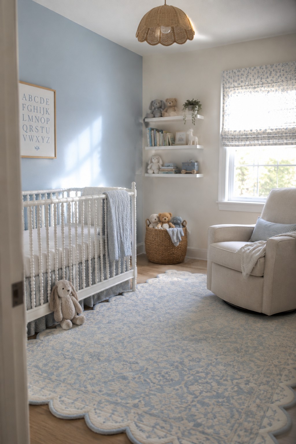 Light blue nursery with white crib, scalloped rug, toy shelves, and beige armchair.