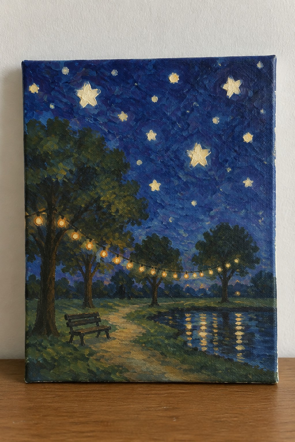 Nighttime park painting with string lights on trees, bench by reflective water under stars