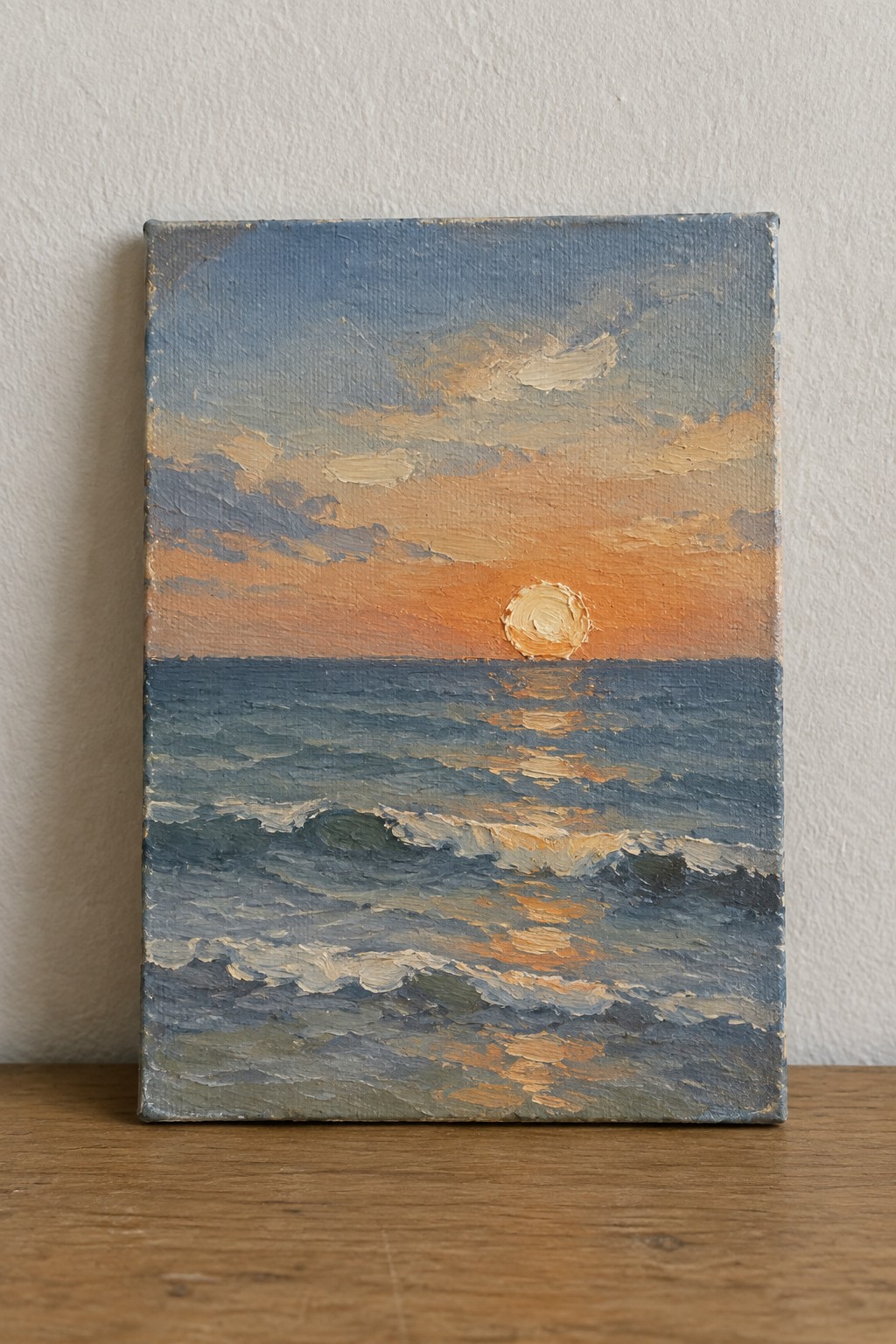 Impressionist oil painting of orange sunset over blue ocean waves on wood.