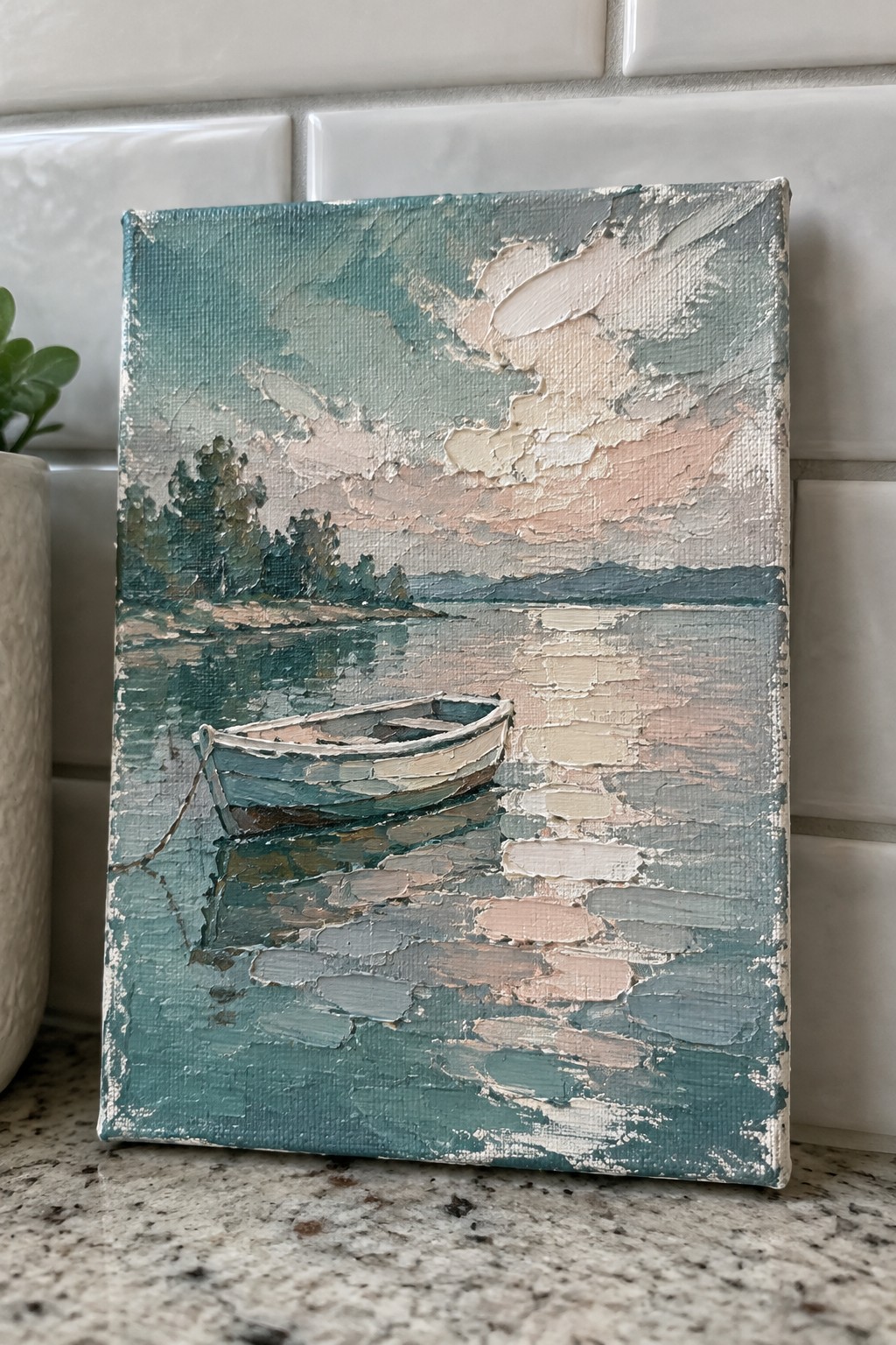 Impasto painting of rowboat on calm teal water under pink cloudy sky with trees.