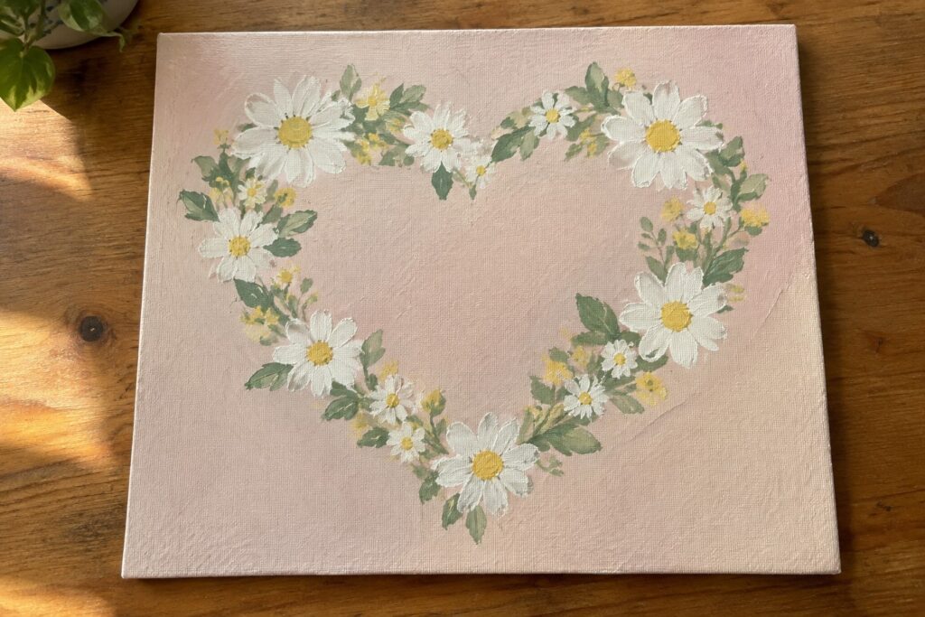19 Cute Painting Ideas Featuring Flowers and Hearts Heart-shaped wreath of white daisies with yellow centers on pink canvas