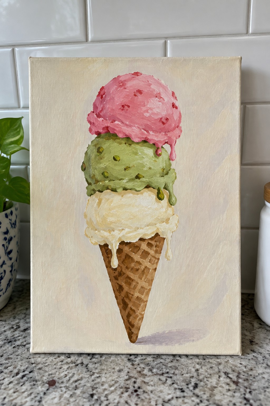 Three-scoop melting ice cream cone painting with pink, green, and vanilla drips on canvas.