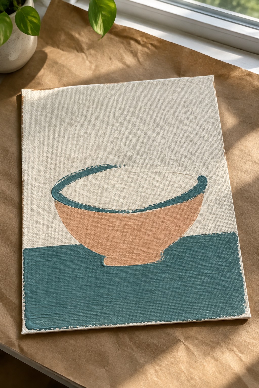 Minimalist canvas painting of peach bowl with teal rim on surface