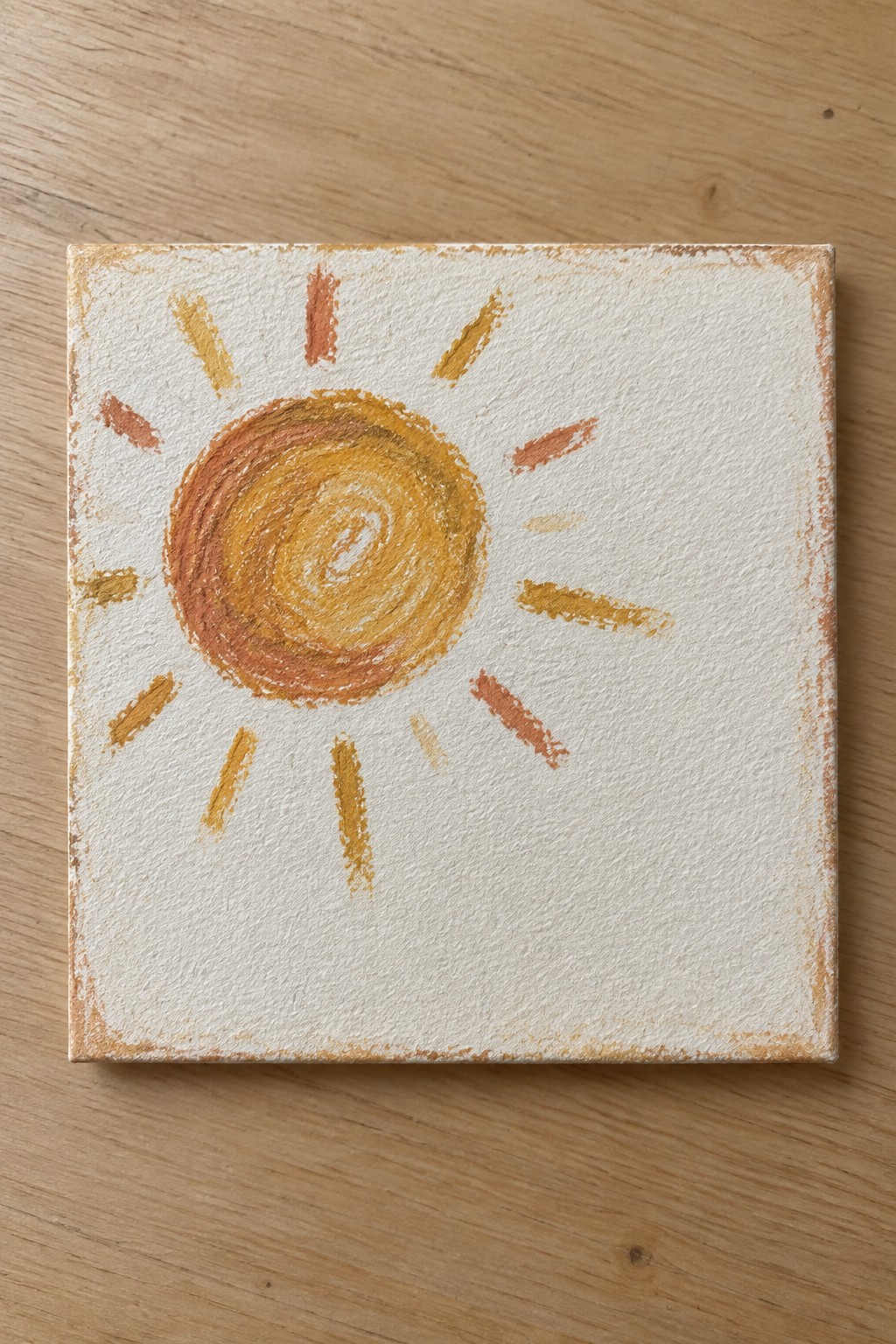 Swirling yellow-orange sun with short rays on textured white square canvas