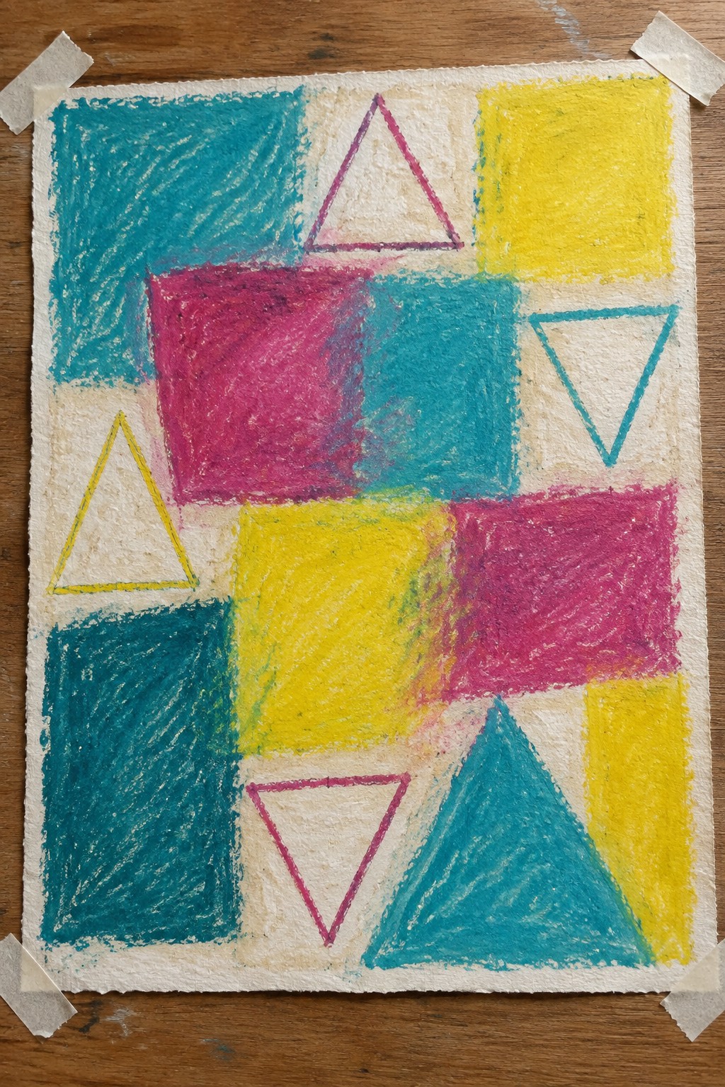 Colorful abstract painting taped to wood showing overlapping teal, yellow, magenta, and pink squares and rectangles with several outlined triangles in yellow, pink, and teal.