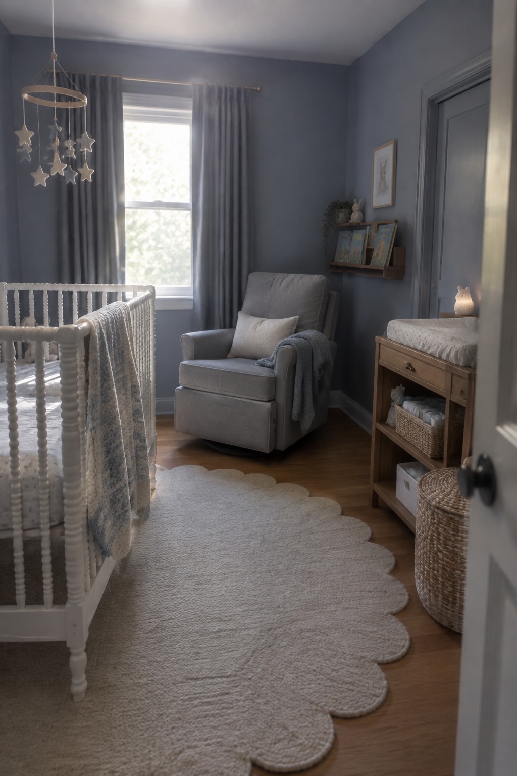 Muted slate blue walls in a bedroom with white trim and wood flooring.