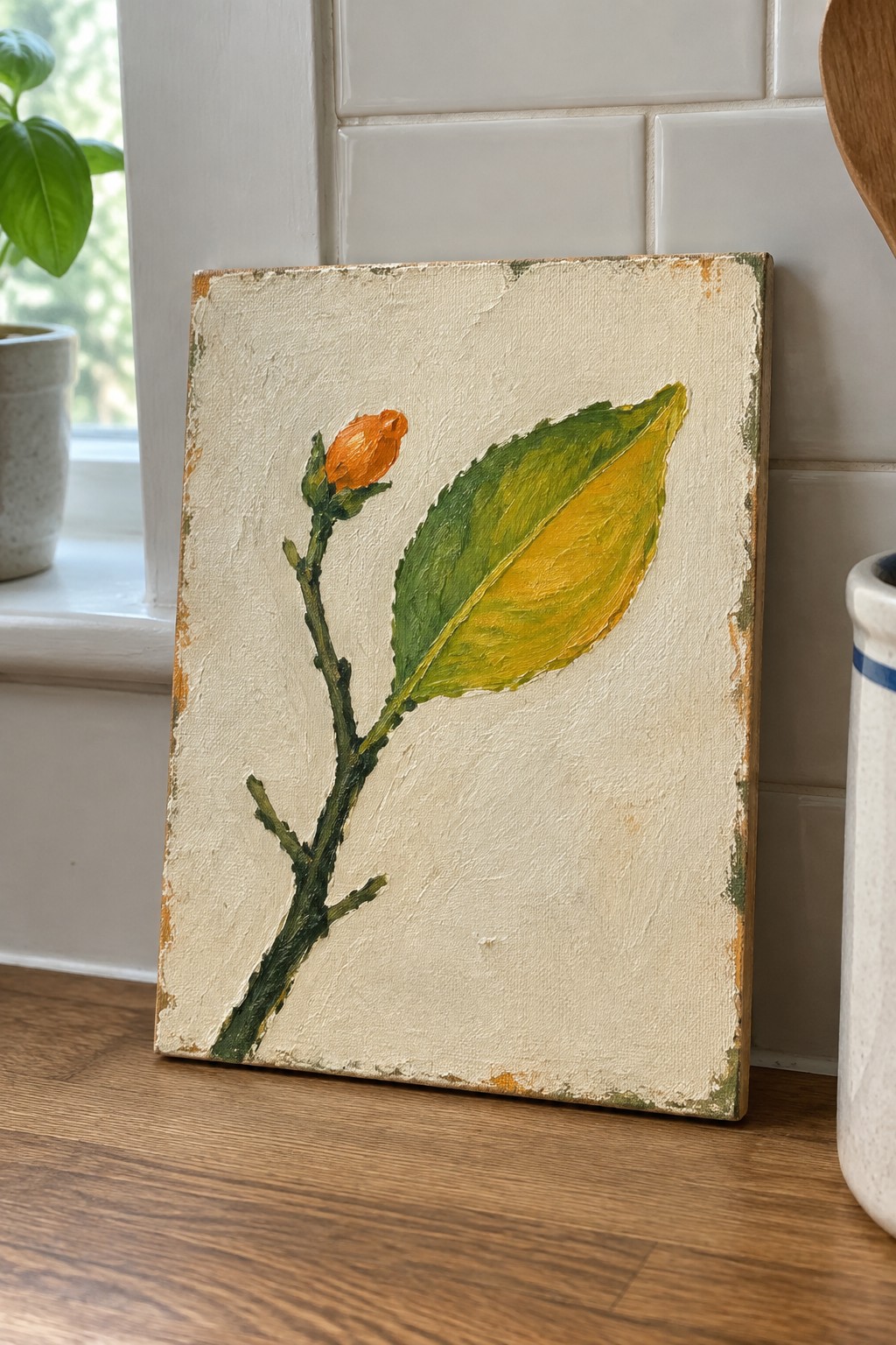 Canvas painting of green stem with yellow leaf and orange bud