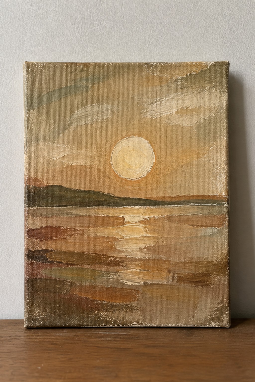 Serene sunset painting with glowing sun over reflective waters and distant hills