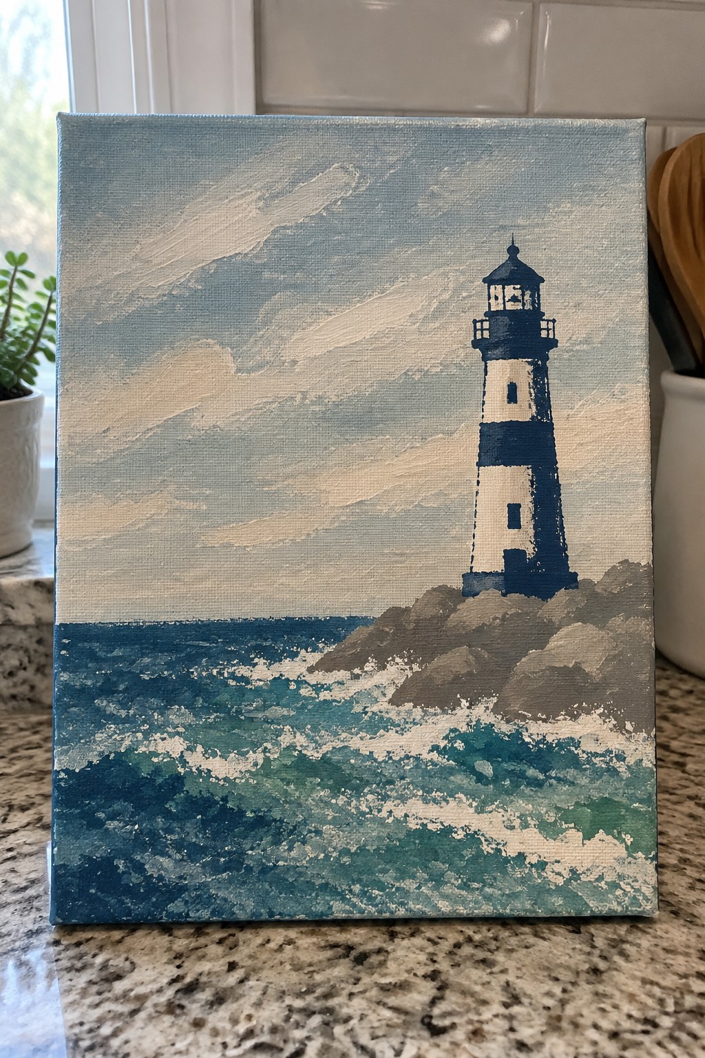 Canvas painting of striped lighthouse on rocky cliff above crashing blue-green ocean waves