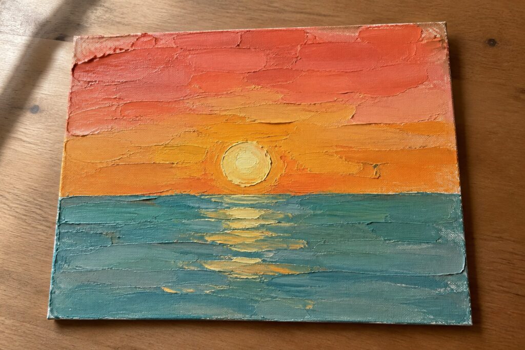 23 Easy Palette-Knife Painting Ideas for Beginners Using Simple Textures Thickly textured sunset painting with orange sky, yellow sun, and teal ocean reflections.