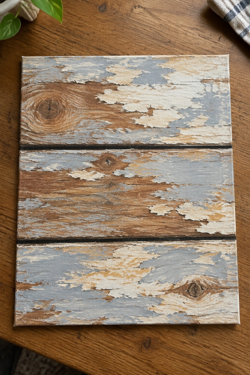 Distressed canvas mimicking three weathered wood planks with peeling white and gray paint