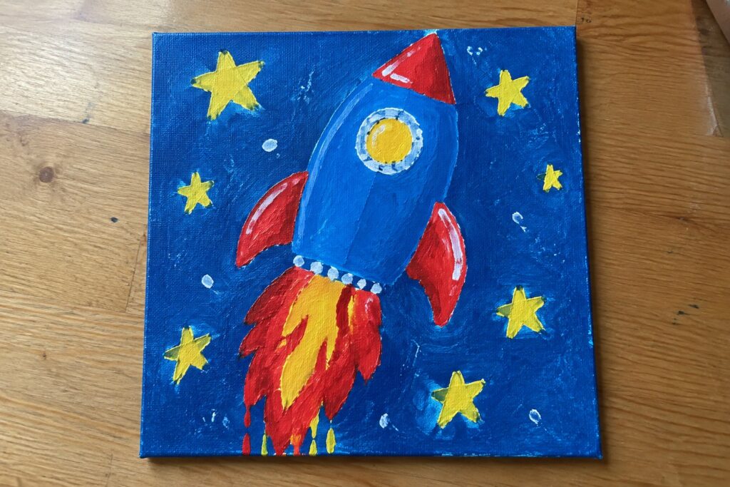 24 Fun Painting Ideas for Kids Using Bright Primary Colors Blue rocket with red fins launching amid yellow stars on blue canvas