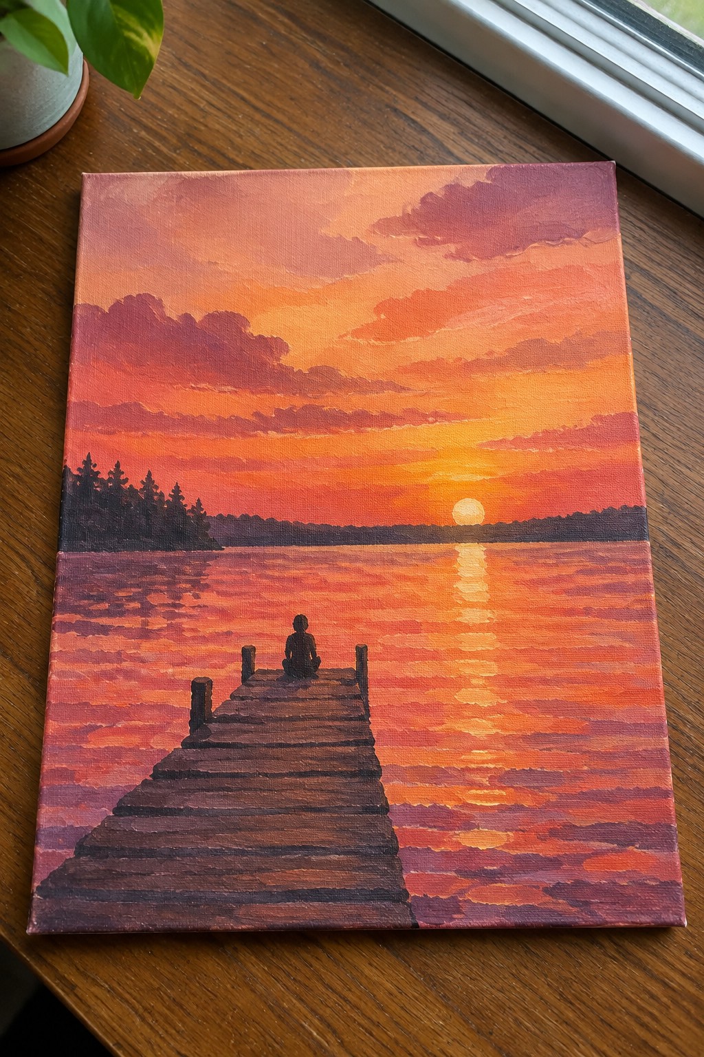 Silhouetted figure on wooden dock gazes at vibrant orange-pink sunset reflecting on lake